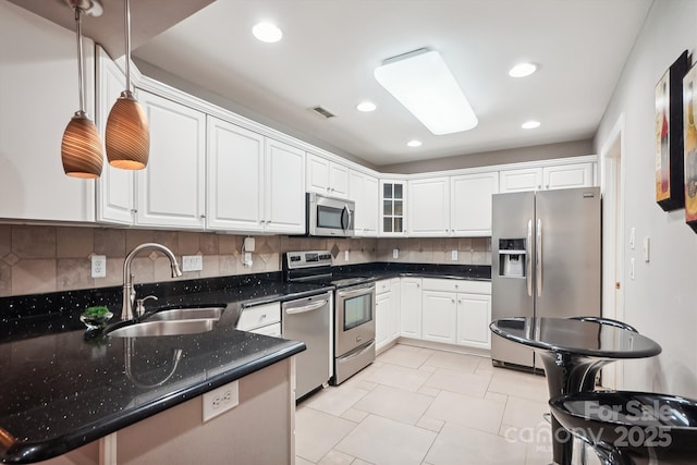 7444 Hurstbourne Green Dr, Charlotte, NC 28277 - kitchen featuring white cabinets, a sink, visible vents, and stainless steel appliances