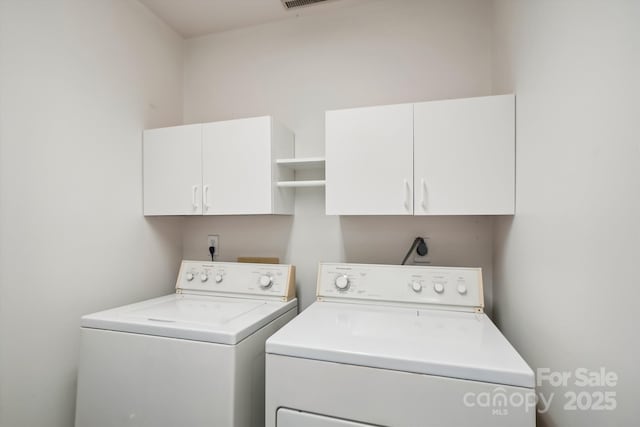 7444 Hurstbourne Green Dr, Charlotte, NC 28277 - laundry room featuring cabinet space, visible vents, and washer and dryer