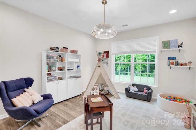 recreation room with recessed lighting, baseboards, visible vents, and light wood-style flooring