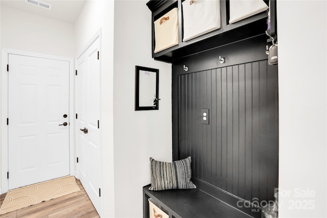mudroom featuring light wood-style flooring and visible vents