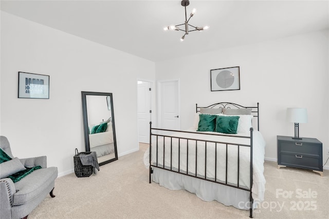 bedroom with baseboards, carpet flooring, and a chandelier