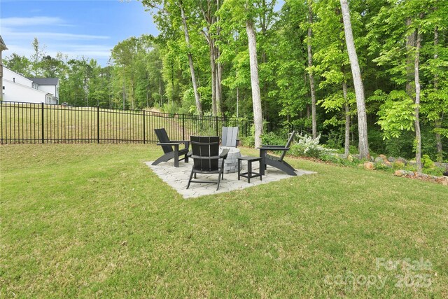 view of yard with fence and a patio