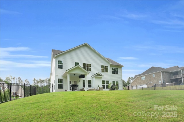 rear view of property with a yard and fence
