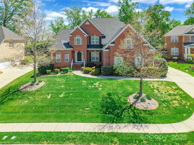 4333 Sawmill Trace Dr, Charlotte, NC 28213 - view of front facade with concrete driveway, a front yard, and brick siding
