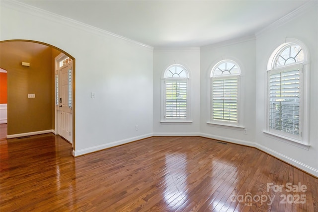 4333 Sawmill Trace Dr, Charlotte, NC 28213 - unfurnished room featuring arched walkways, wood-type flooring, baseboards, and crown molding