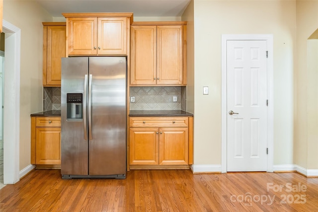 4333 Sawmill Trace Dr, Charlotte, NC 28213 - kitchen with stainless steel fridge with ice dispenser, light wood-style flooring, and dark countertops