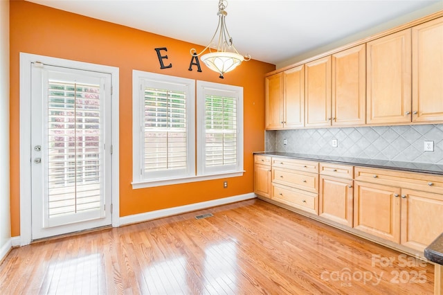 4333 Sawmill Trace Dr, Charlotte, NC 28213 - kitchen with plenty of natural light, light wood-type flooring, and light brown cabinets