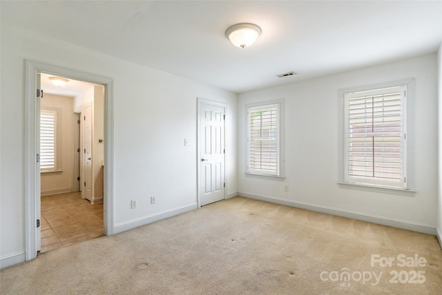 4333 Sawmill Trace Dr, Charlotte, NC 28213 - unfurnished bedroom featuring a closet, carpet flooring, visible vents, and baseboards
