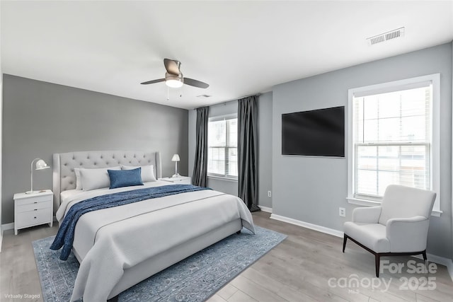 2059 Lennox Square Rd, Charlotte, NC 28210 - bedroom with baseboards, light wood-type flooring, and a ceiling fan