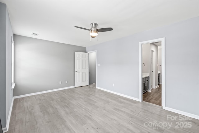 2059 Lennox Square Rd, Charlotte, NC 28210 - unfurnished bedroom with light wood-type flooring, baseboards, ensuite bath, and ceiling fan