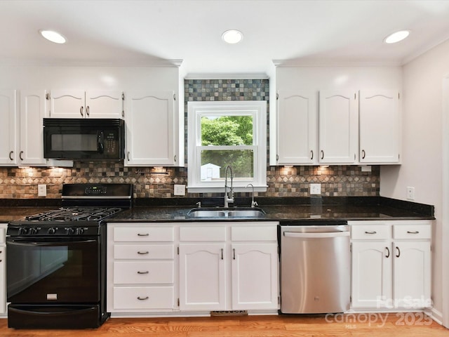 915 Gate Rd, Monroe, NC 28112 - kitchen with black appliances, a sink, white cabinetry, ornamental molding, and tasteful backsplash