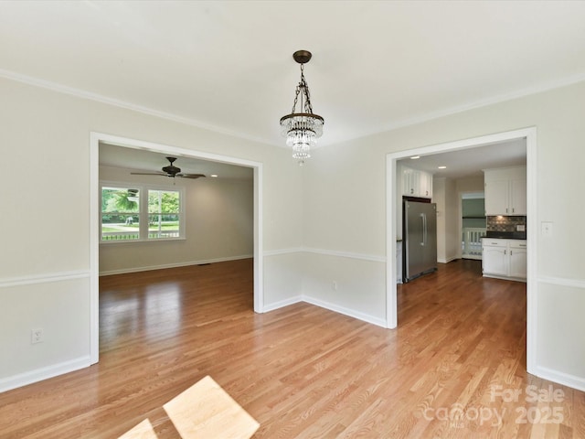 915 Gate Rd, Monroe, NC 28112 - unfurnished dining area with light wood-style flooring, baseboards, a ceiling fan, and ornamental molding