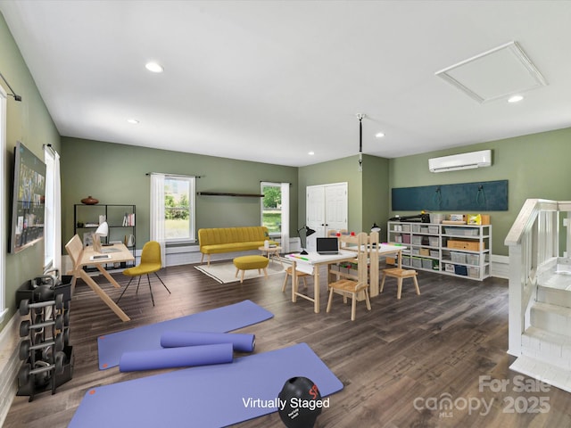 915 Gate Rd, Monroe, NC 28112 - living area featuring an AC wall unit, wood finished floors, and recessed lighting