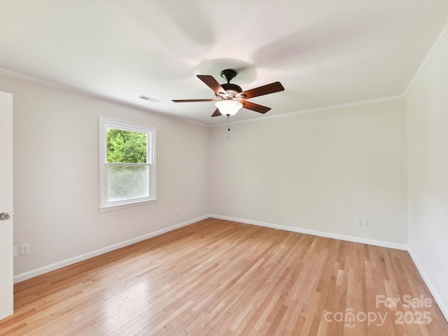915 Gate Rd, Monroe, NC 28112 - spare room featuring light wood-style floors, baseboards, ceiling fan, and crown molding