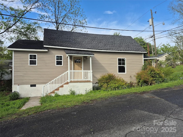 view of front of house with roof with shingles
