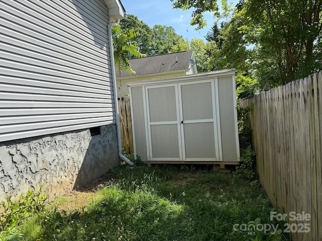 view of shed featuring a fenced backyard
