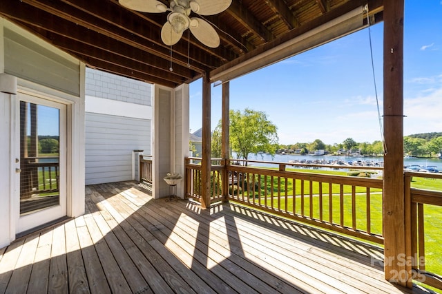 18700 Nautical Dr Unit 203, Cornelius, NC 28031 - deck featuring a water view, ceiling fan, and a yard