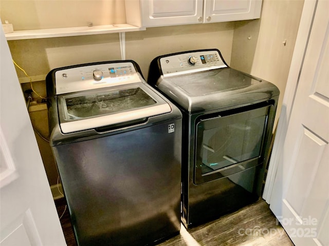 18700 Nautical Dr Unit 203, Cornelius, NC 28031 - laundry room with cabinet space, independent washer and dryer, and wood finished floors