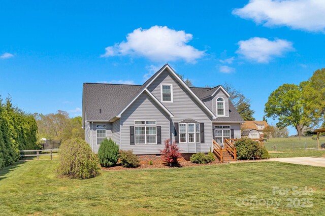 126 Top Flite Dr, Statesville, NC 28677 - view of front facade featuring crawl space, a front yard, fence, and a shingled roof