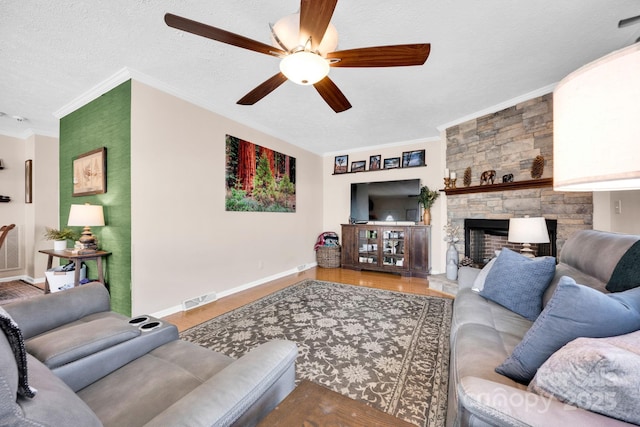 126 Top Flite Dr, Statesville, NC 28677 - living room with ceiling fan, wood finished floors, visible vents, and ornamental molding