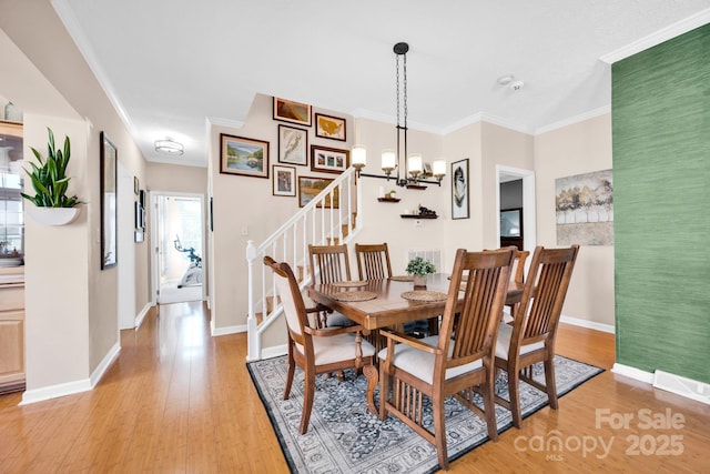 126 Top Flite Dr, Statesville, NC 28677 - dining space featuring light wood-style flooring, baseboards, and ornamental molding