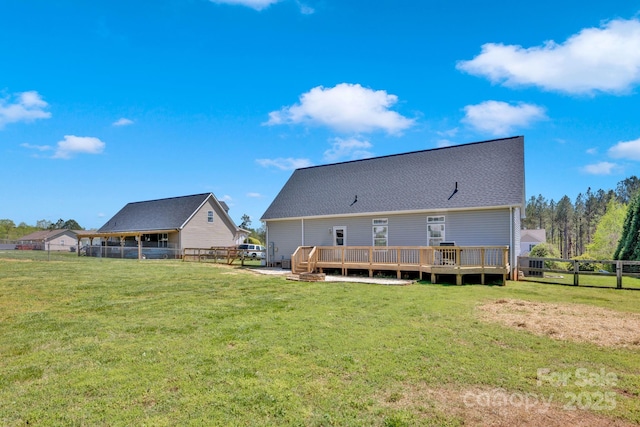 126 Top Flite Dr, Statesville, NC 28677 - rear view of house with a shingled roof, a fenced backyard, a yard, and a deck