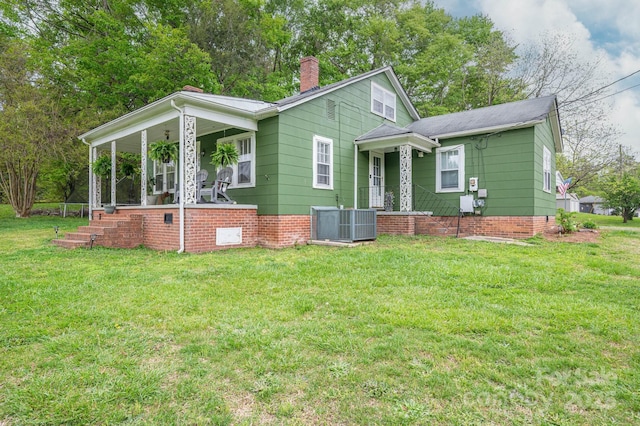 211 Hershel Lackey Rd, Lincolnton, NC 28092 - view of front of property featuring a chimney, a front lawn, a porch, and cooling unit