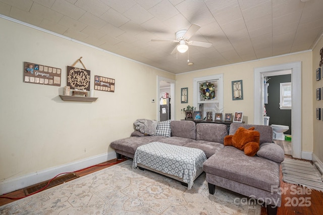 211 Hershel Lackey Rd, Lincolnton, NC 28092 - living room with wood finished floors, a ceiling fan, baseboards, and ornamental molding