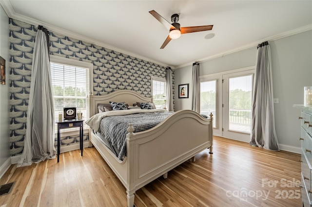 bedroom featuring ornamental molding, baseboards, access to outside, and light wood-type flooring