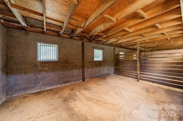 below grade area featuring concrete block wall