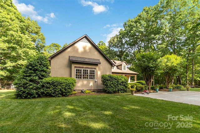 4925 Pageland Hwy, Monroe, NC 28112 - view of side of home featuring a yard and stucco siding