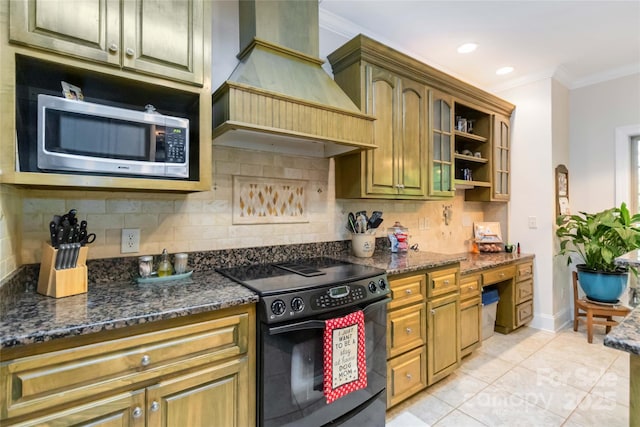 4925 Pageland Hwy, Monroe, NC 28112 - kitchen featuring black electric range, premium range hood, stainless steel microwave, decorative backsplash, and ornamental molding