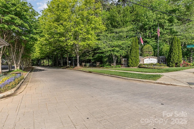 view of road with curbs and sidewalks