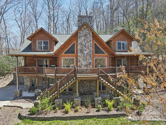 475 S Toe River Rd, Burnsville, NC 28714 - back of property featuring log siding, stone siding, a patio area, and stairway