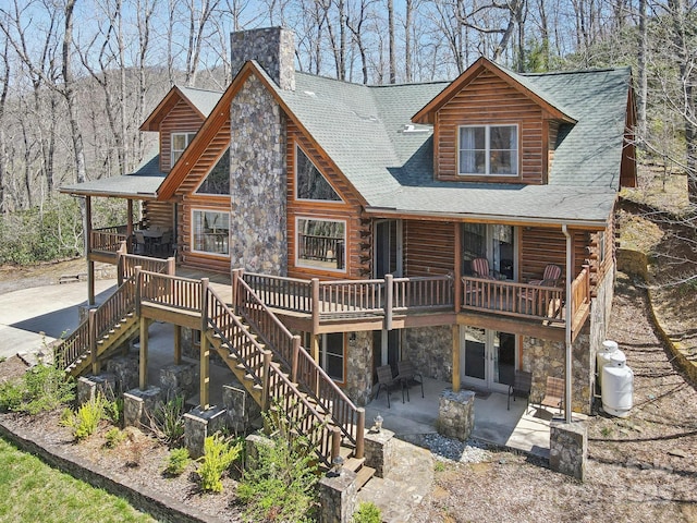 475 S Toe River Rd, Burnsville, NC 28714 - back of house with log exterior, a patio area, stone siding, a chimney, and french doors