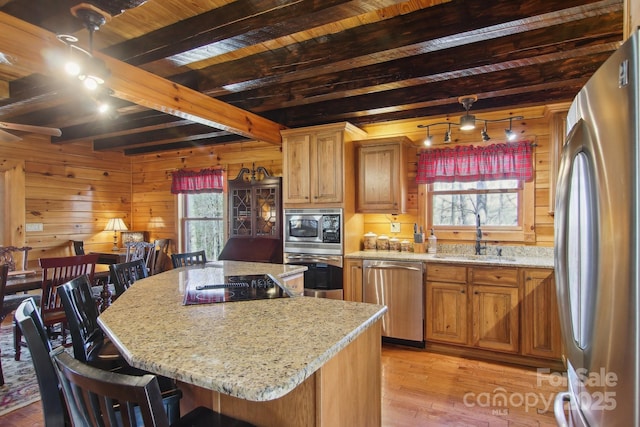 475 S Toe River Rd, Burnsville, NC 28714 - kitchen featuring a sink, beamed ceiling, appliances with stainless steel finishes, and a healthy amount of sunlight