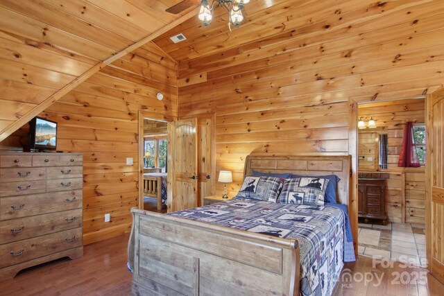 475 S Toe River Rd, Burnsville, NC 28714 - bedroom with wood walls and wood finished floors