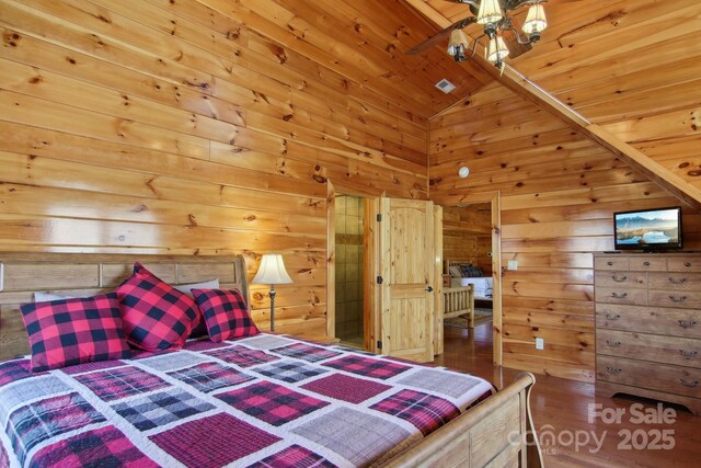475 S Toe River Rd, Burnsville, NC 28714 - bedroom featuring wood ceiling, wood finished floors, wooden walls, and vaulted ceiling