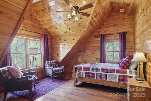 475 S Toe River Rd, Burnsville, NC 28714 - bedroom featuring wooden walls, wood-type flooring, and lofted ceiling