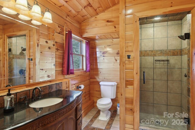 475 S Toe River Rd, Burnsville, NC 28714 - bathroom featuring a shower stall, vanity, toilet, wooden ceiling, and lofted ceiling