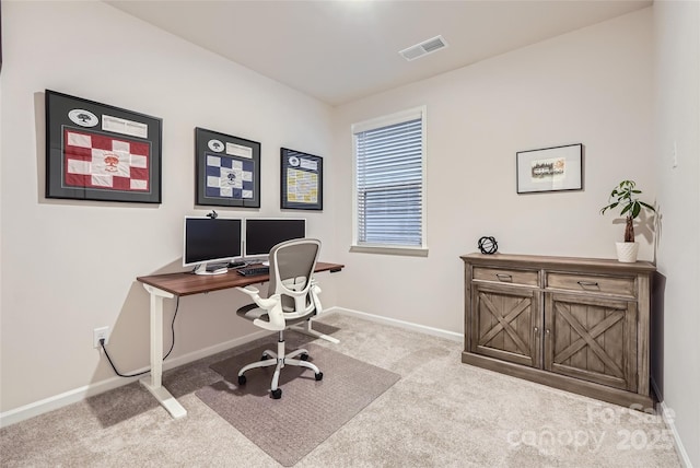 carpeted office featuring baseboards and visible vents
