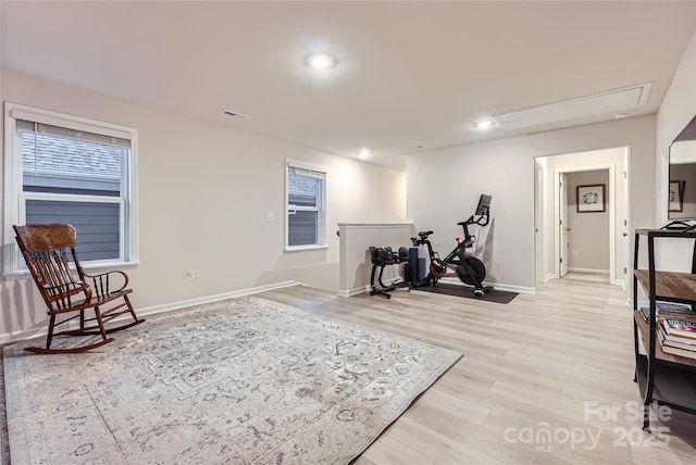 workout room with visible vents, baseboards, attic access, light wood-type flooring, and recessed lighting