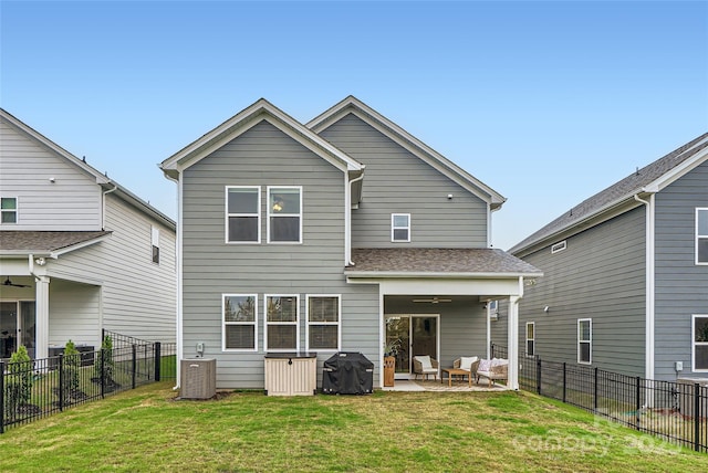 rear view of house with a patio, ceiling fan, outdoor lounge area, and a fenced backyard