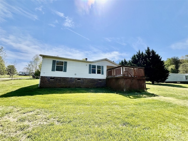105 Branson Dr, Olin, NC 28660 - back of property featuring a yard, a wooden deck, and crawl space