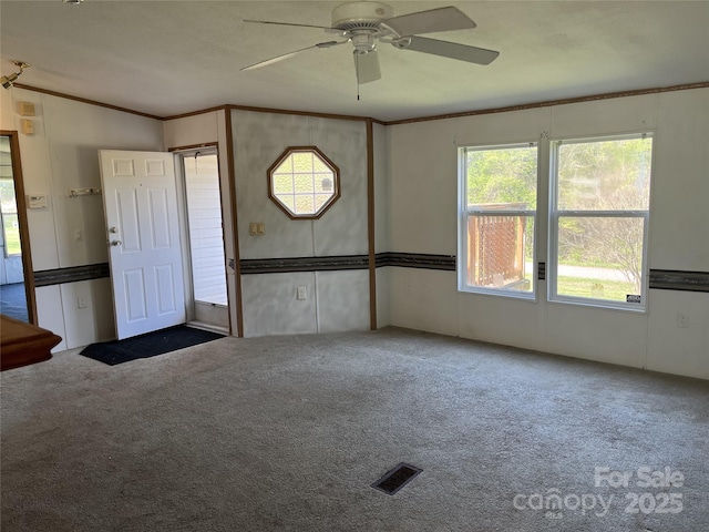 105 Branson Dr, Olin, NC 28660 - entrance foyer with carpet flooring, visible vents, ornamental molding, and ceiling fan