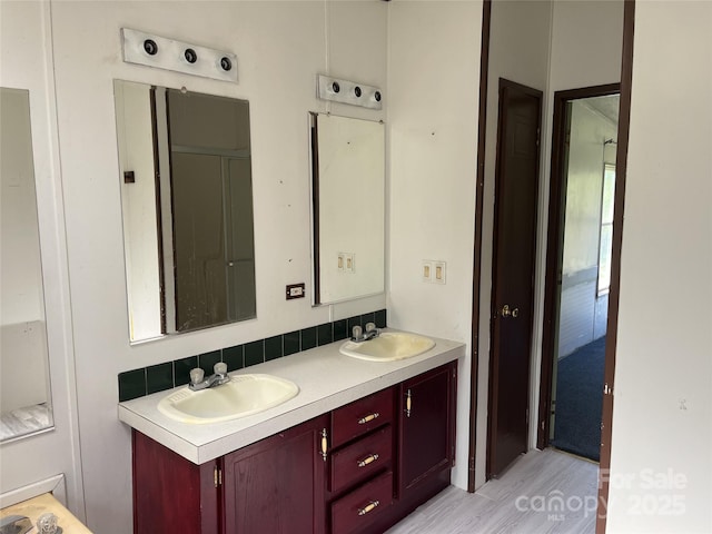 105 Branson Dr, Olin, NC 28660 - full bath featuring a sink, double vanity, and wood finished floors