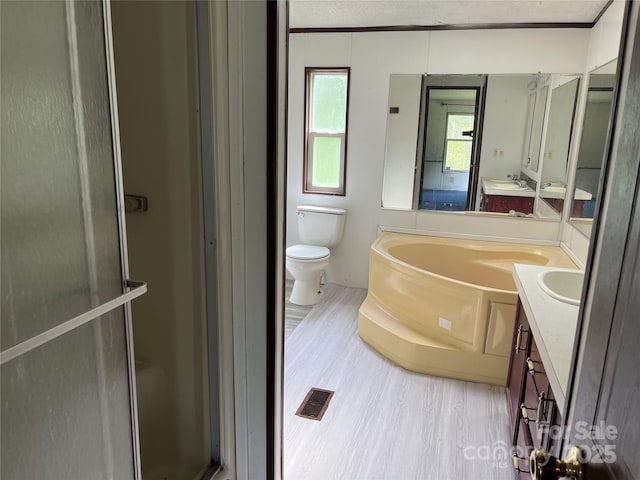 105 Branson Dr, Olin, NC 28660 - bathroom featuring a bath, toilet, a shower stall, and vanity