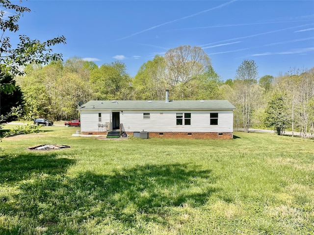 105 Branson Dr, Olin, NC 28660 - back of house featuring a yard and crawl space