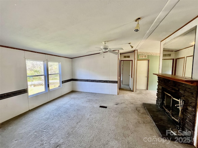 105 Branson Dr, Olin, NC 28660 - unfurnished living room with carpet, ceiling fan, a glass covered fireplace, and visible vents