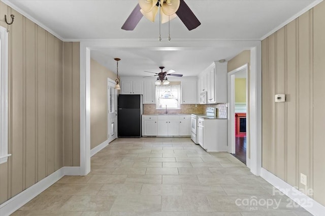 kitchen featuring a ceiling fan, tasteful backsplash, a sink, white appliances, and baseboards